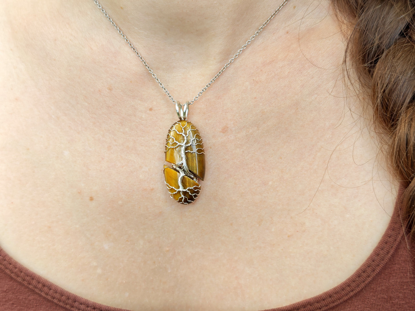 Tree pendant with a broken tiger's eye gemstone