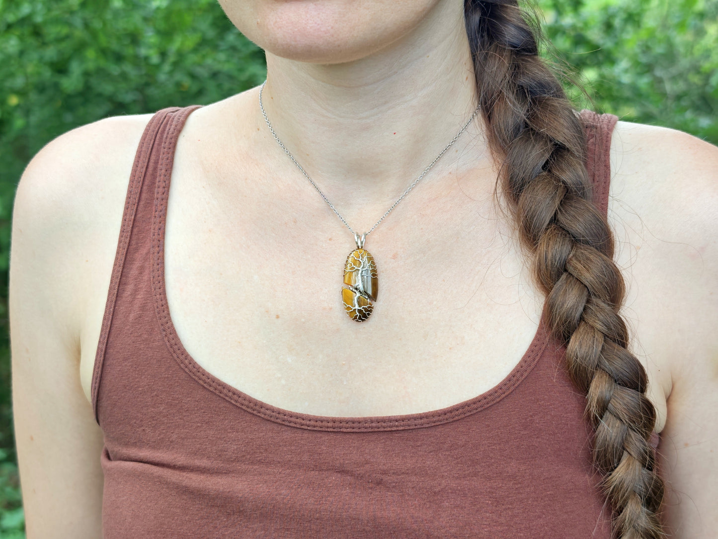 Tree pendant with a broken tiger's eye gemstone