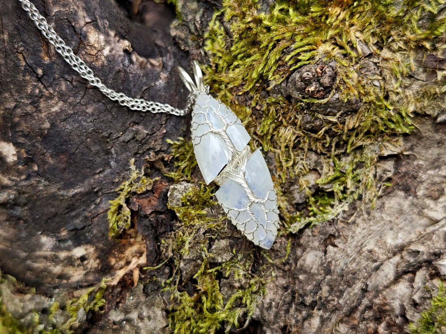 Tree pendant with a broken moonstone