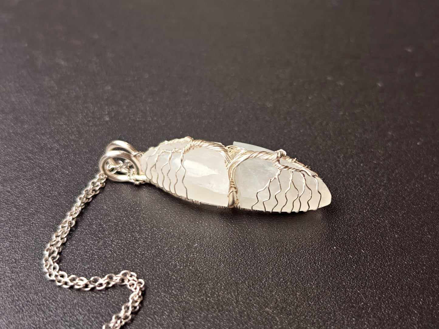 Tree pendant with a broken moonstone