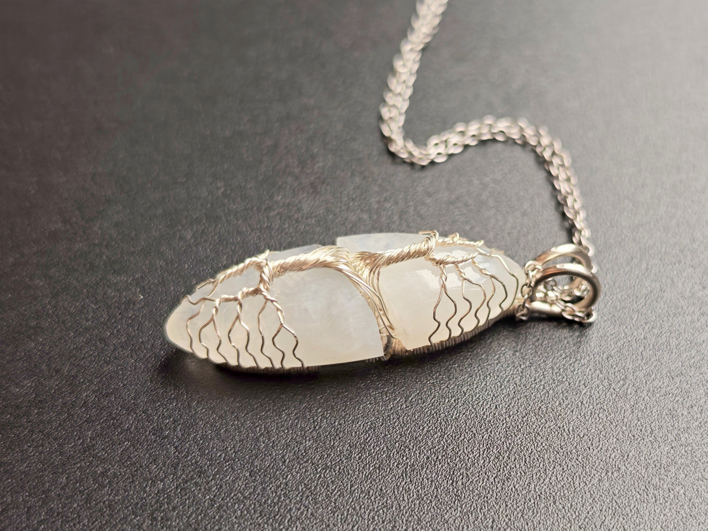 Tree pendant with a broken moonstone