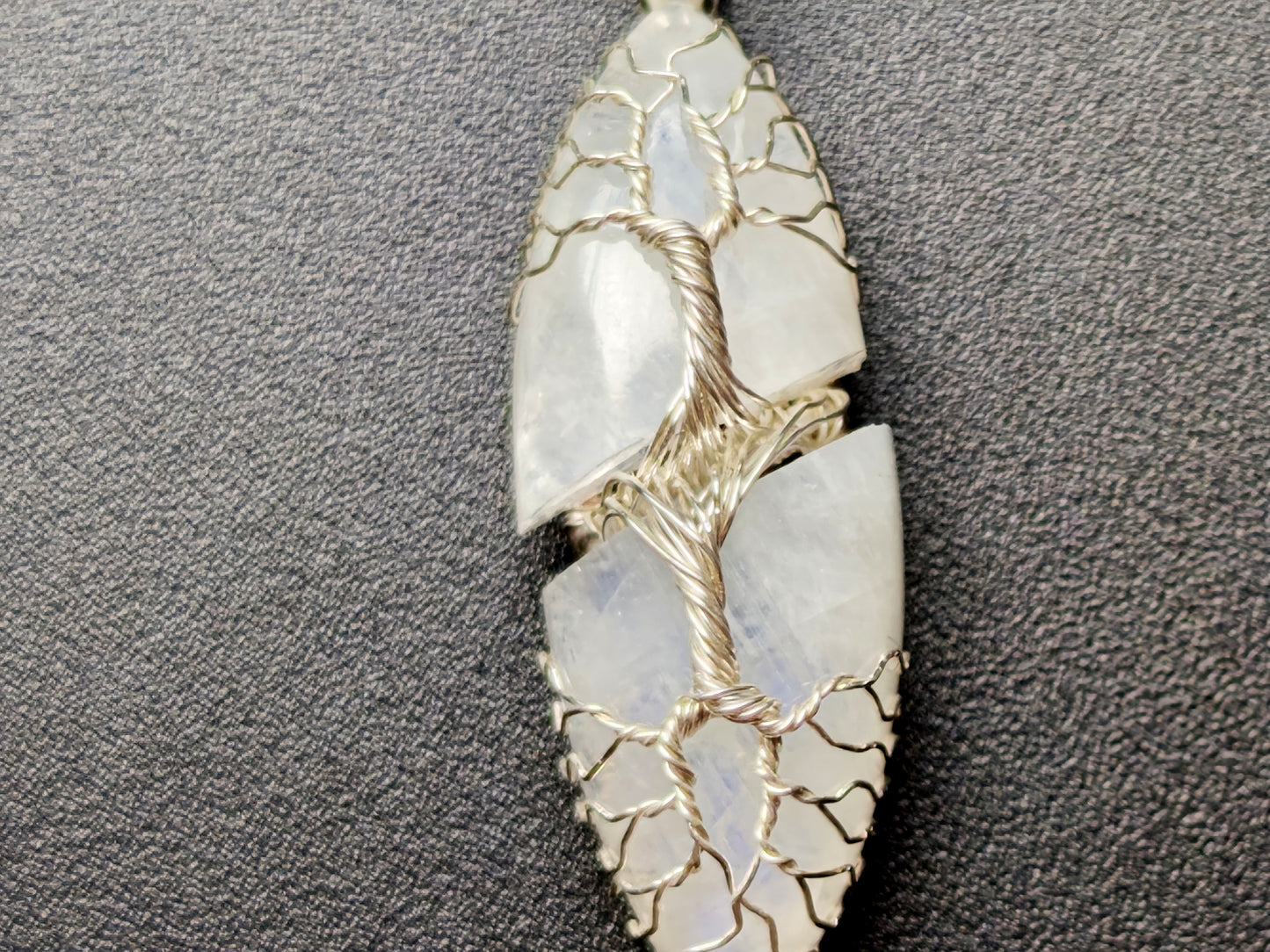 Tree pendant with a broken moonstone