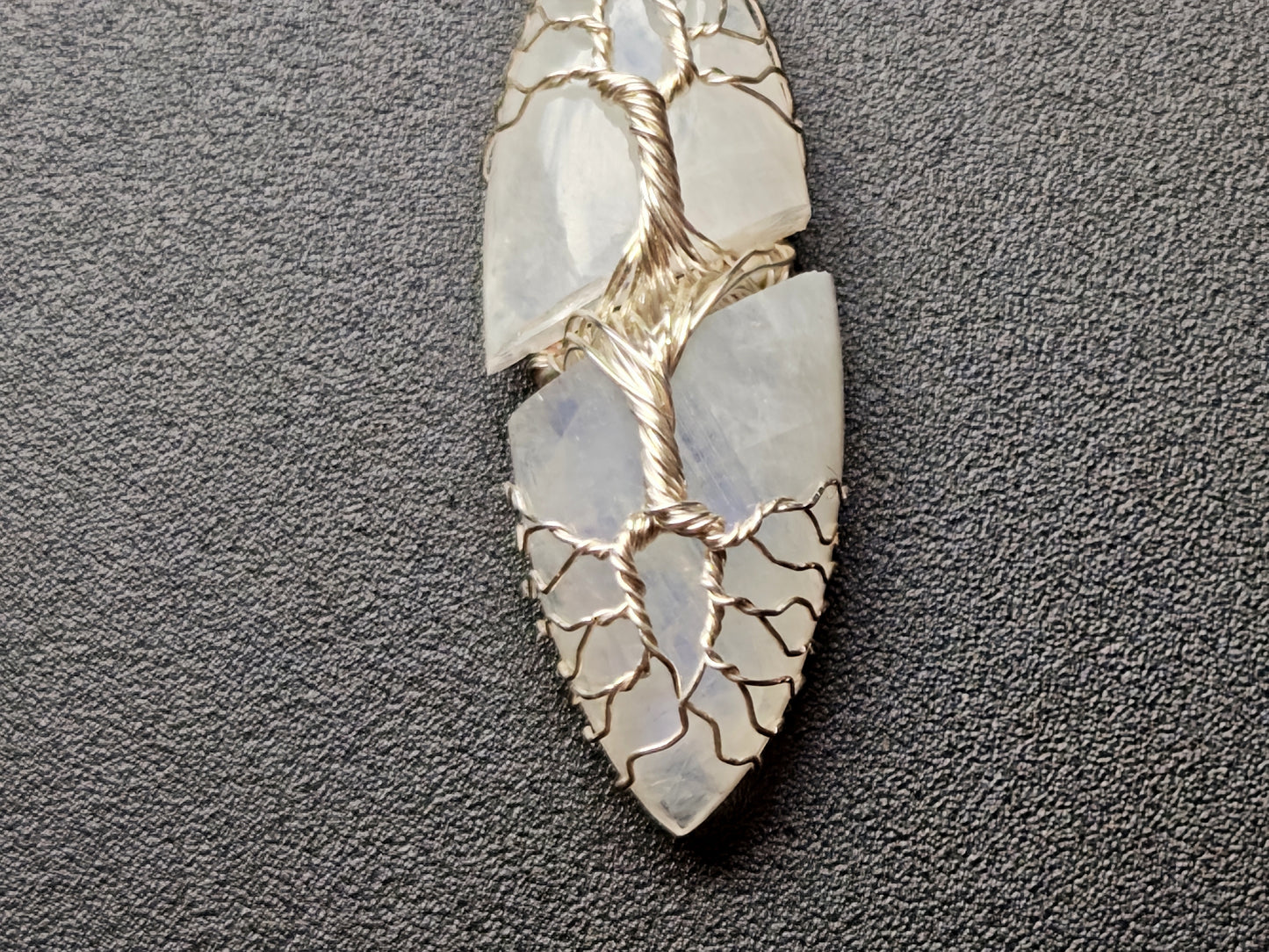 Tree pendant with a broken moonstone