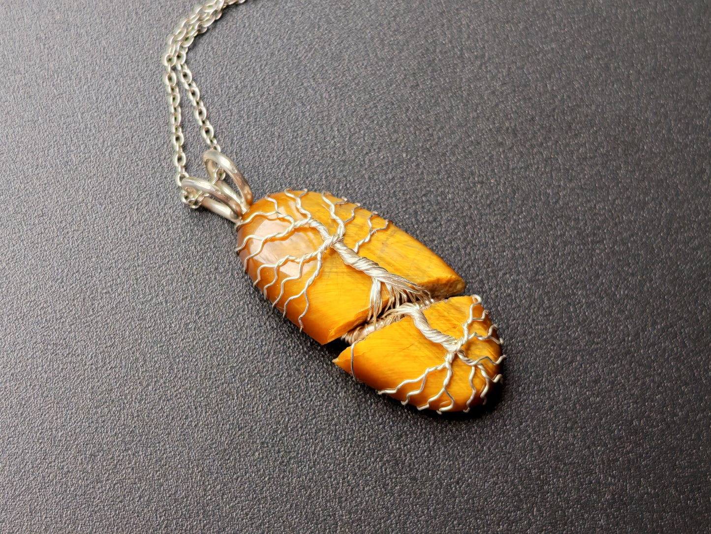 Tree pendant with a broken tiger's eye gemstone