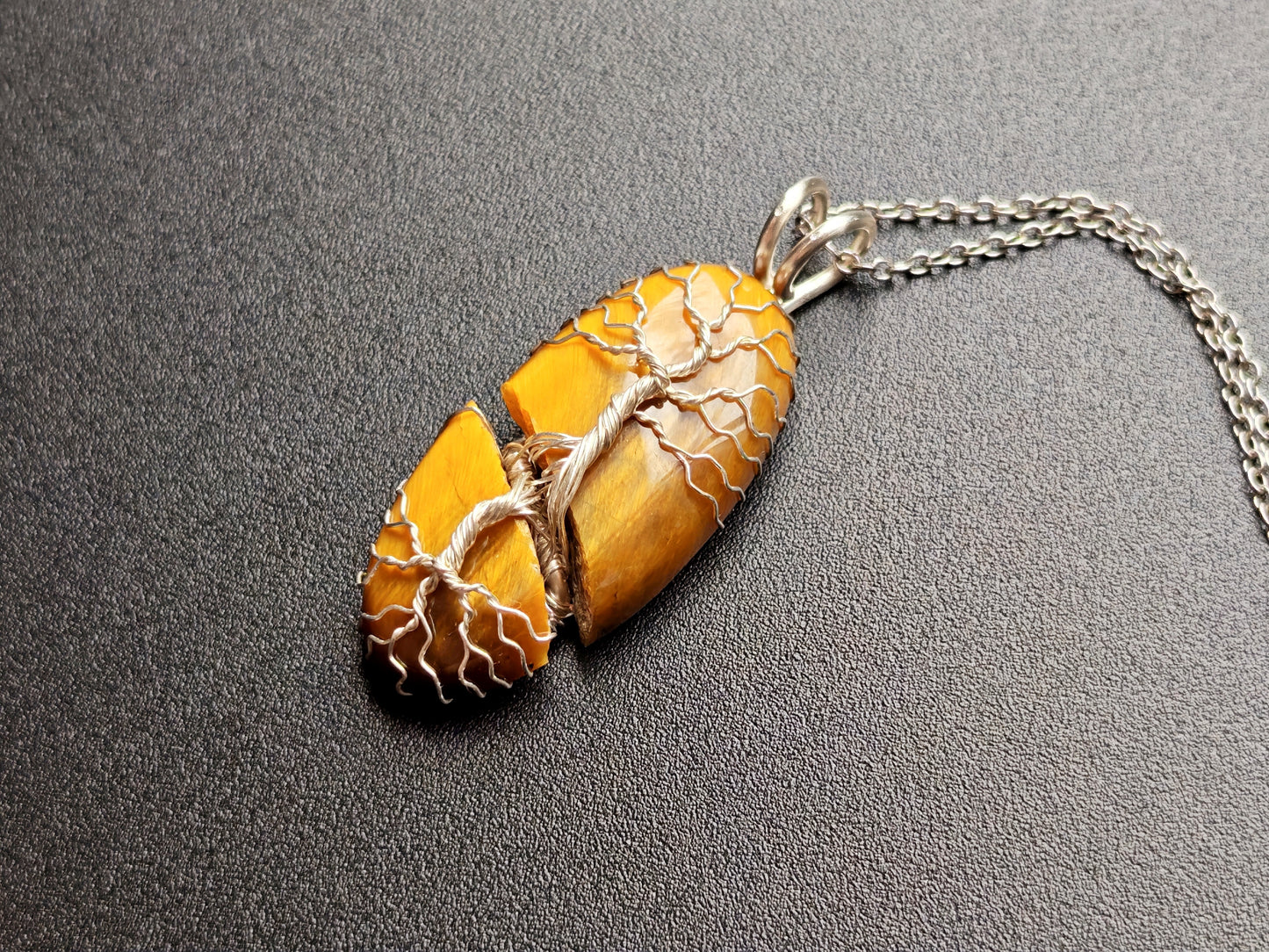 Tree pendant with a broken tiger's eye gemstone
