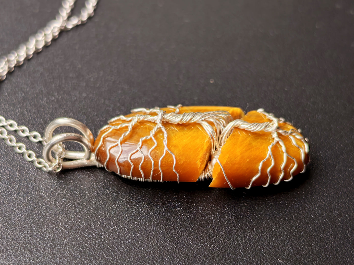Tree pendant with a broken tiger's eye gemstone