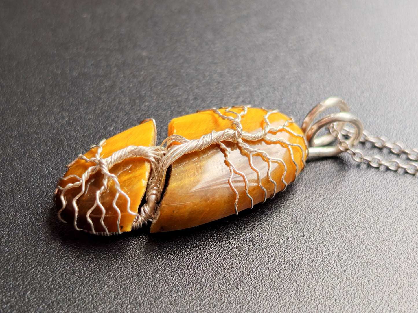 Tree pendant with a broken tiger's eye gemstone