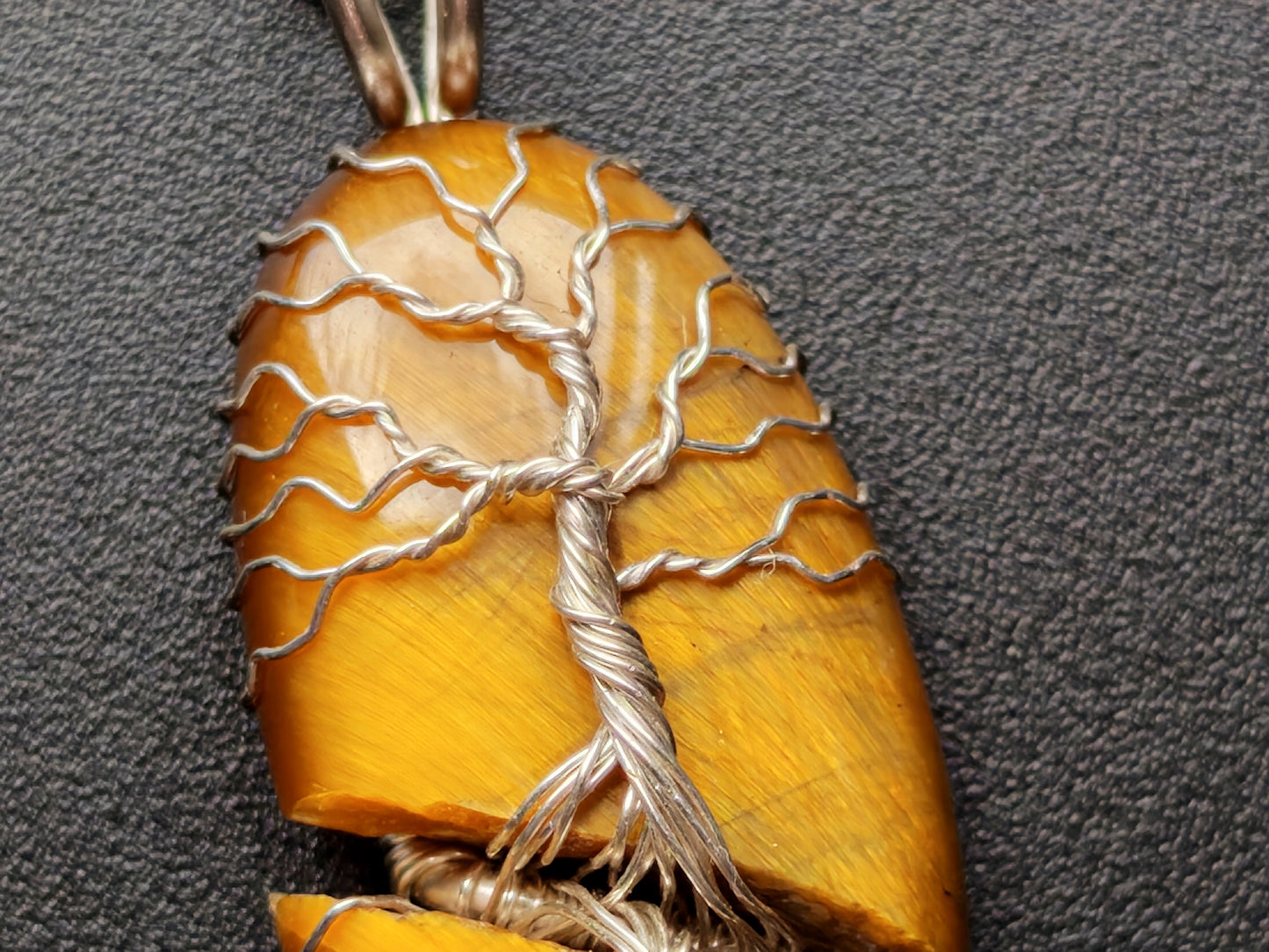 Tree pendant with a broken tiger's eye gemstone