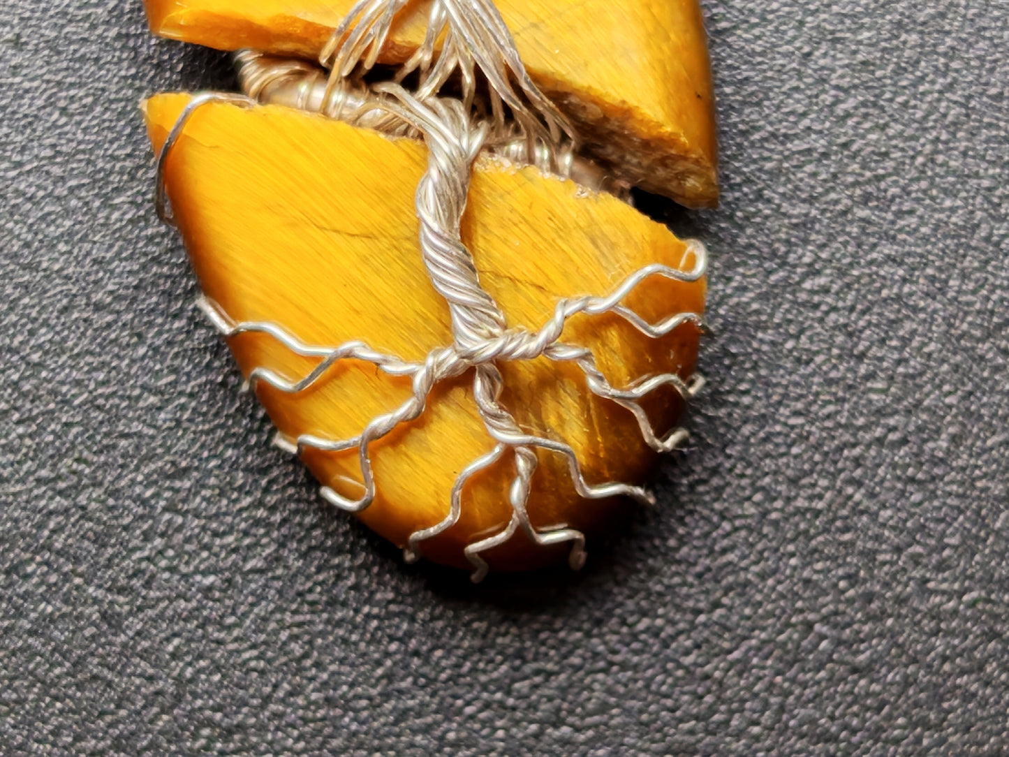Tree pendant with a broken tiger's eye gemstone