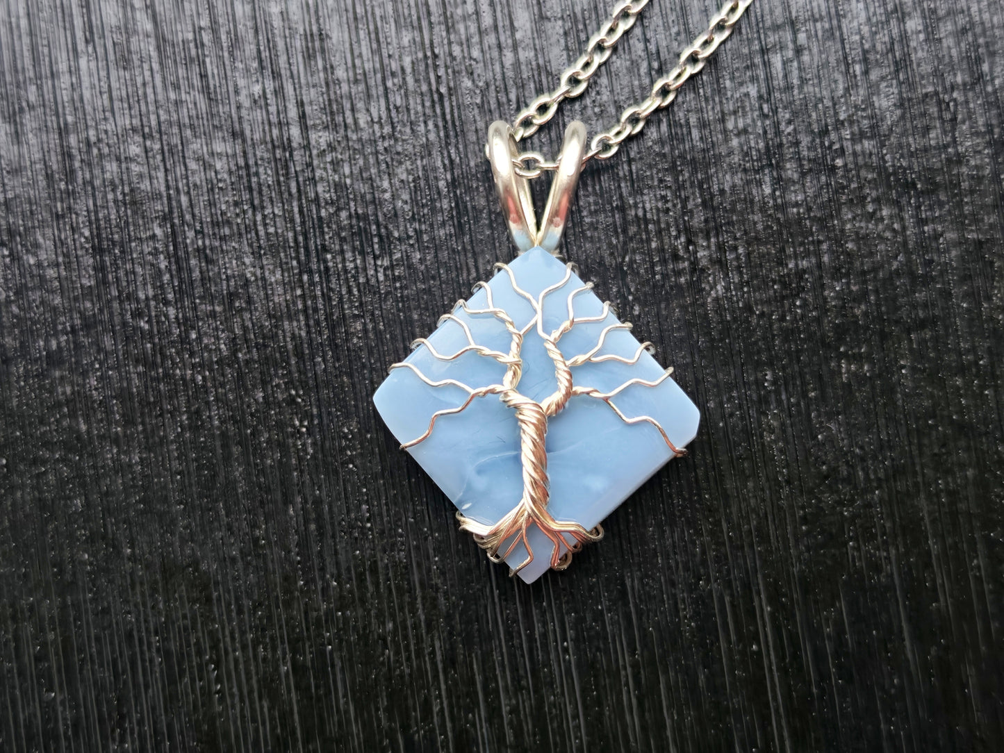 Tree pendant with a blue opal gemstone