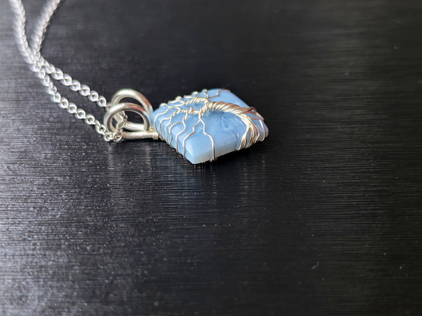 Tree pendant with a blue opal gemstone