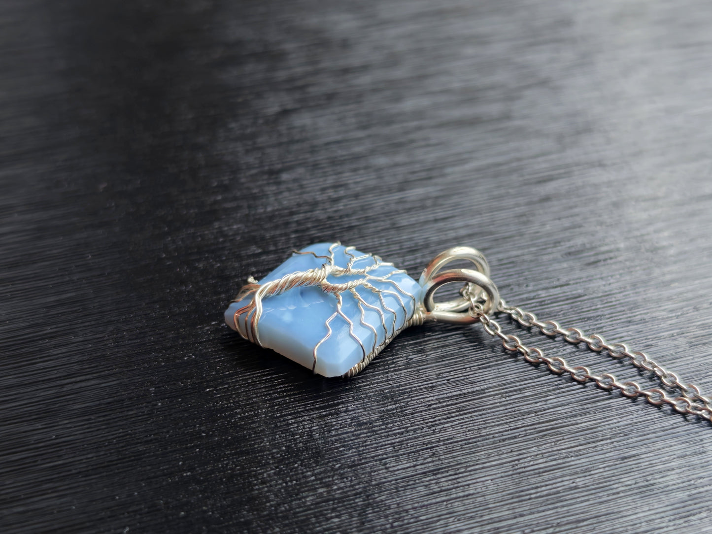 Tree pendant with a blue opal gemstone