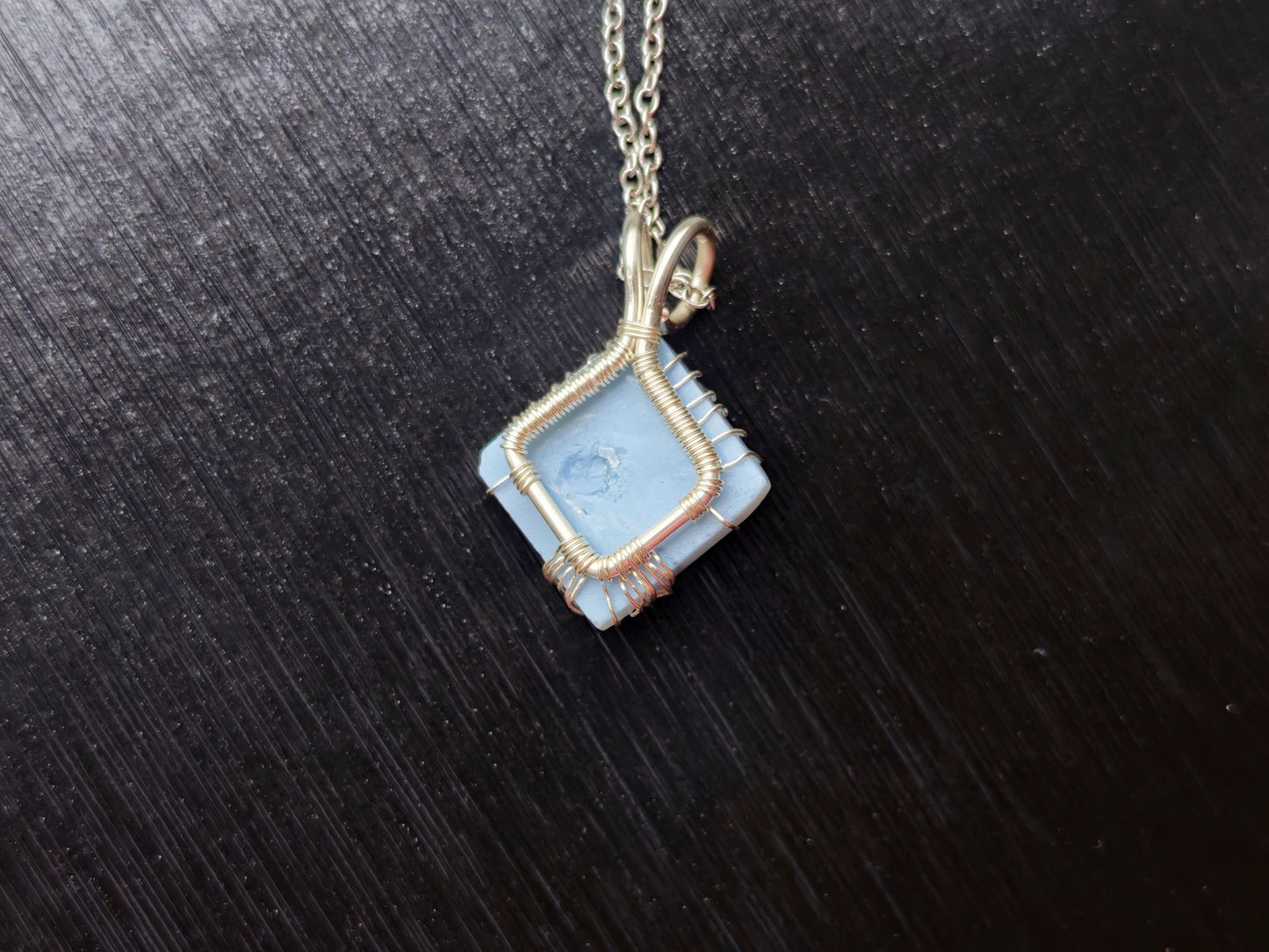 Tree pendant with a blue opal gemstone