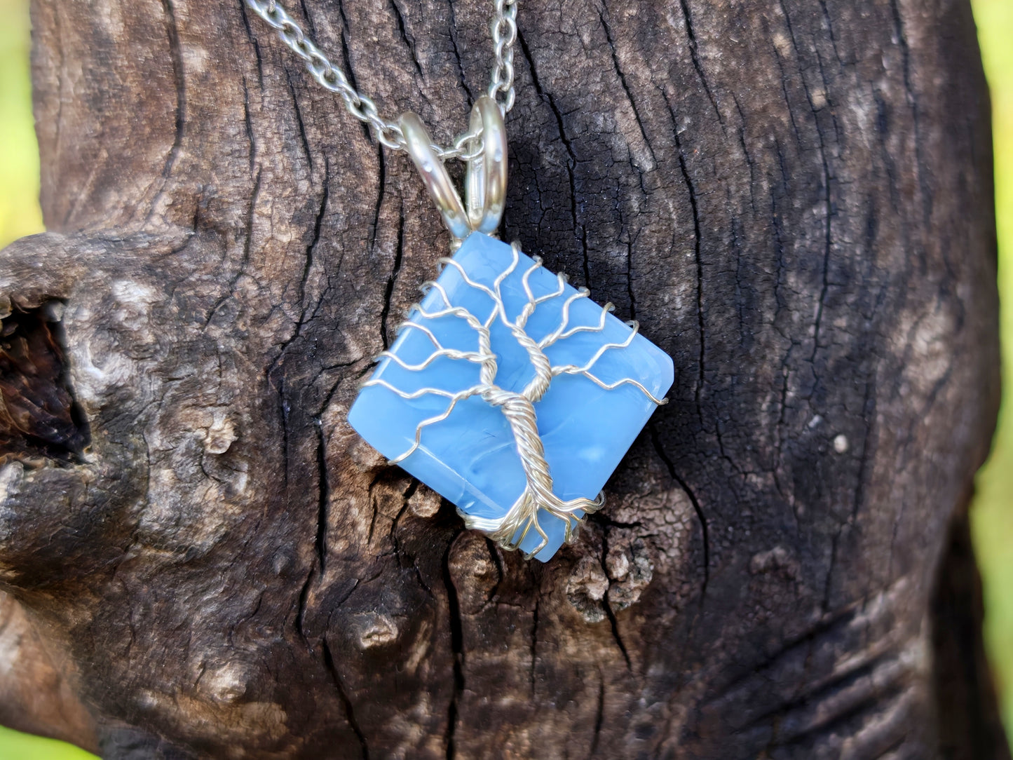 Tree pendant with a blue opal gemstone