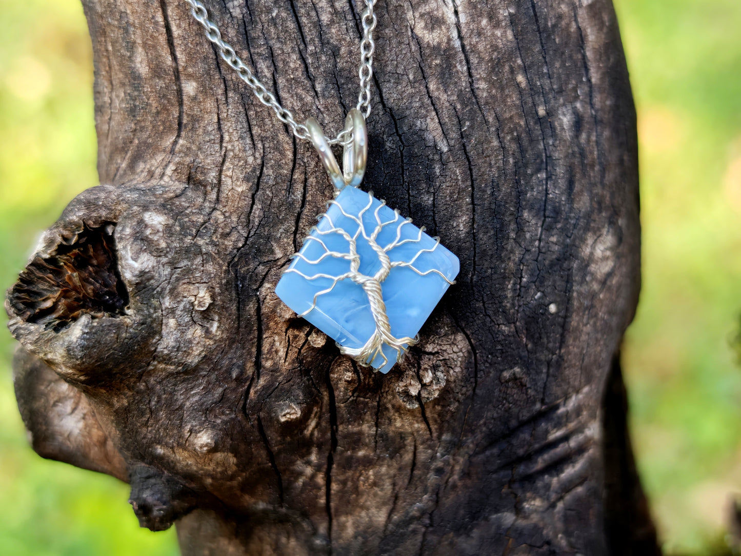 Tree pendant with a blue opal gemstone