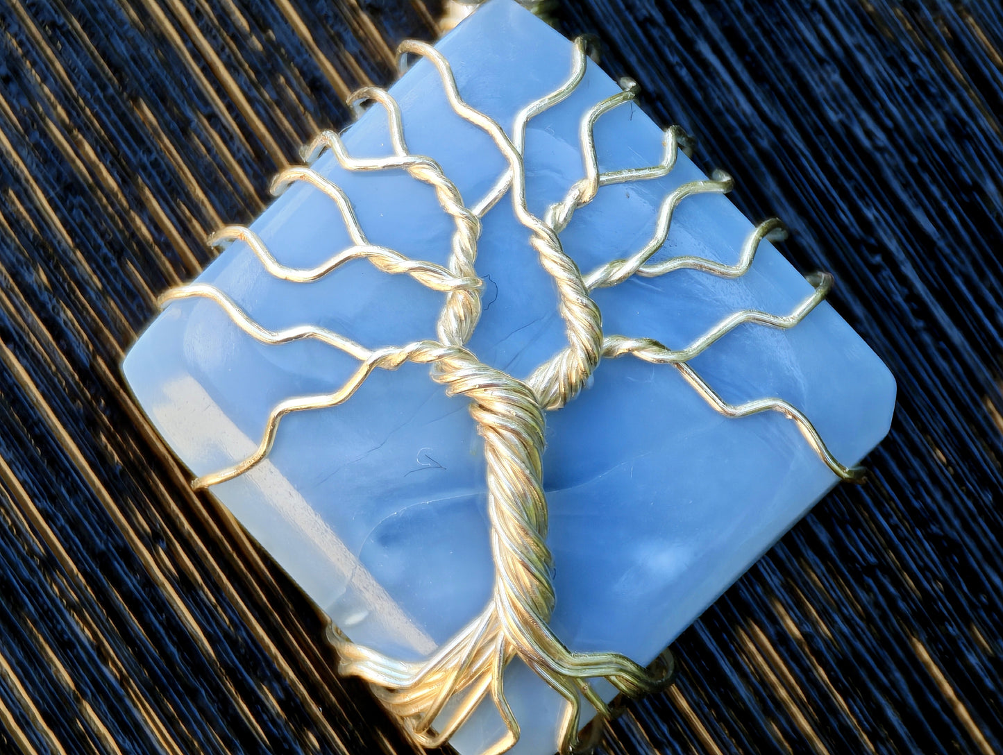 Tree pendant with a blue opal gemstone