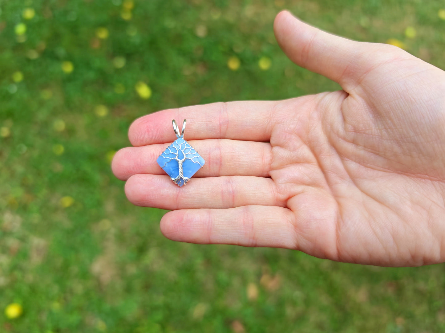 Tree pendant with a blue opal gemstone