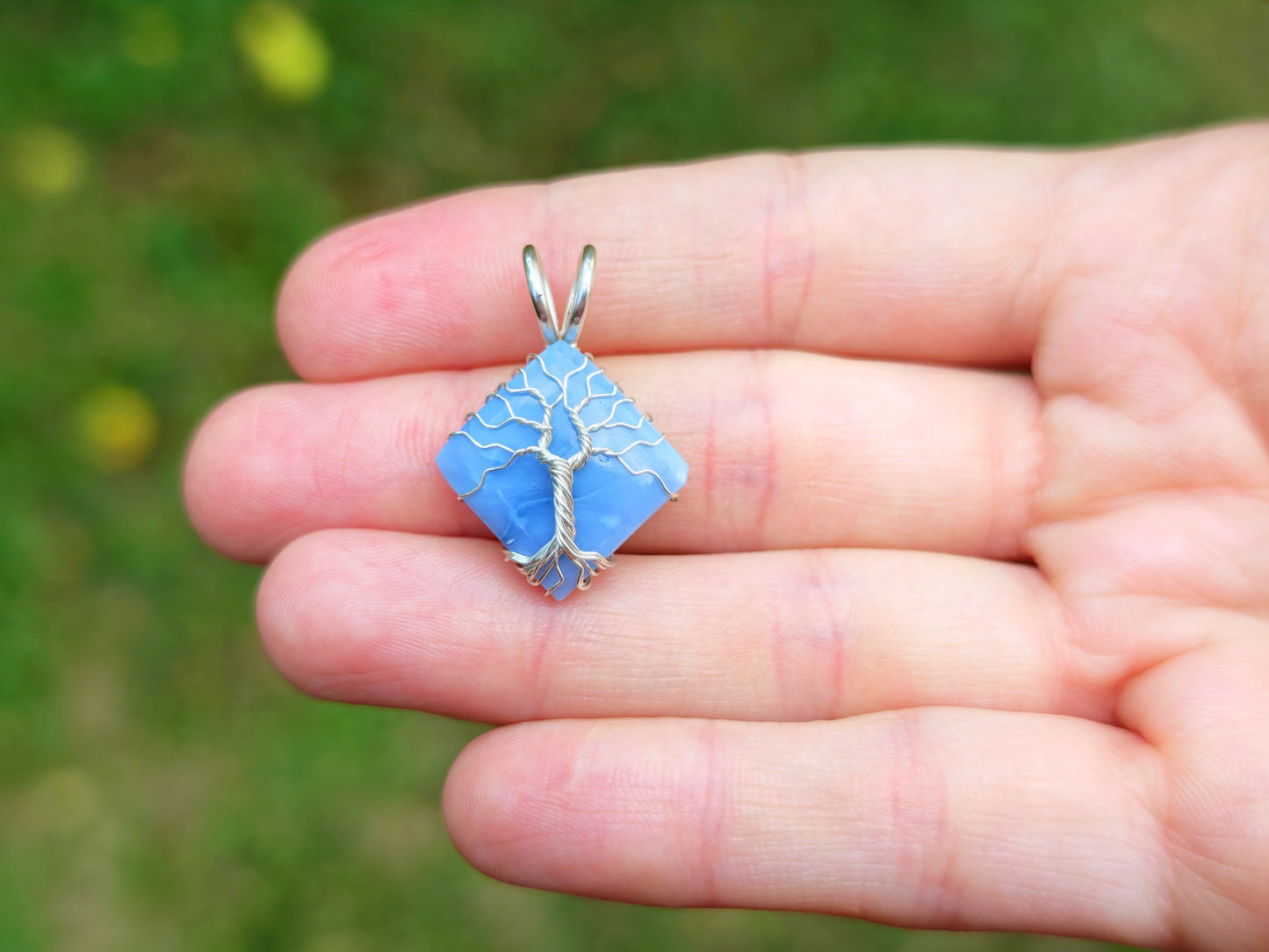 Tree pendant with a blue opal gemstone