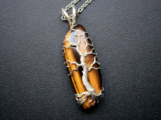 Tree pendant with a tiger's eye gemstone