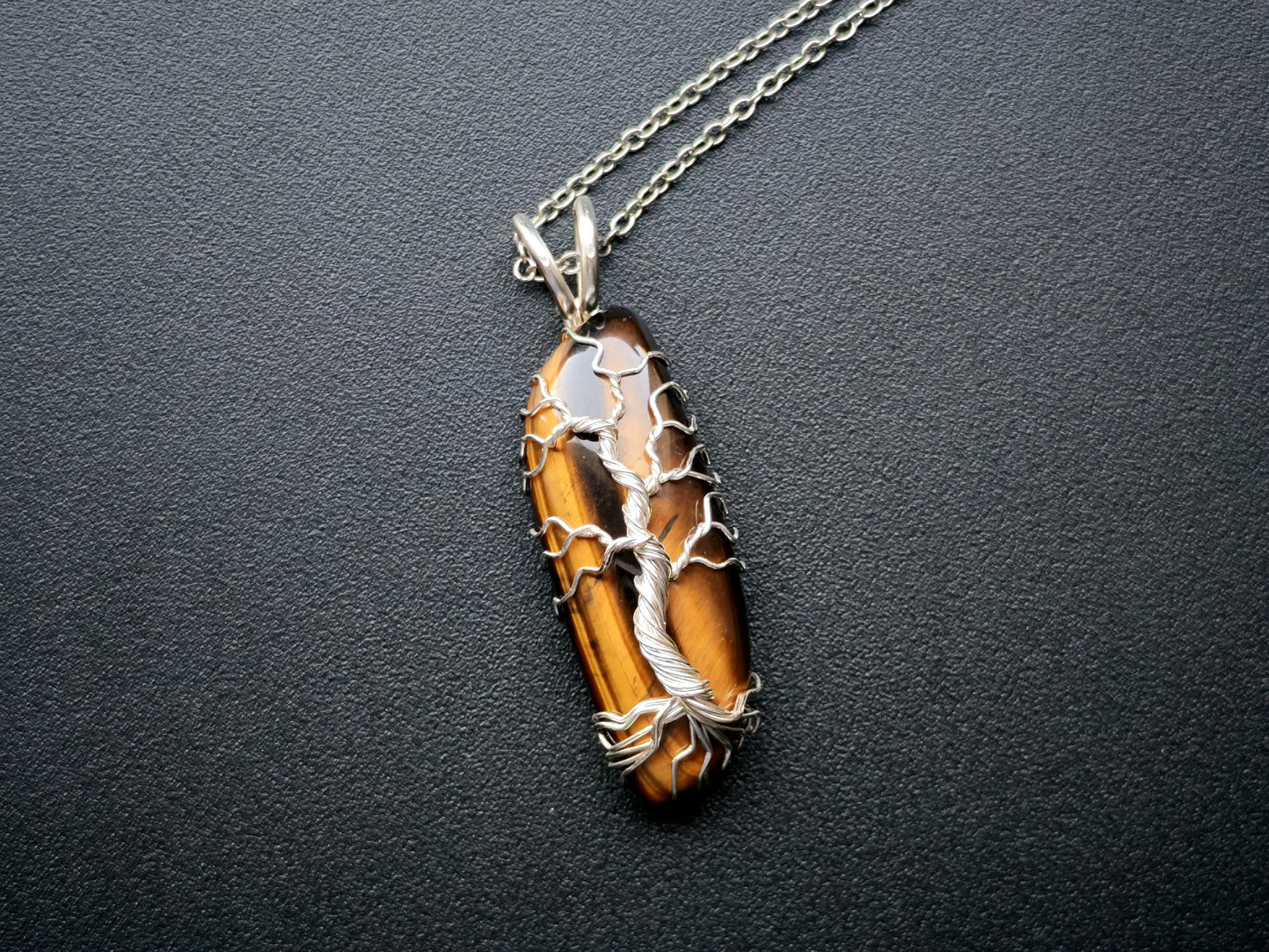 Tree pendant with a tiger's eye gemstone