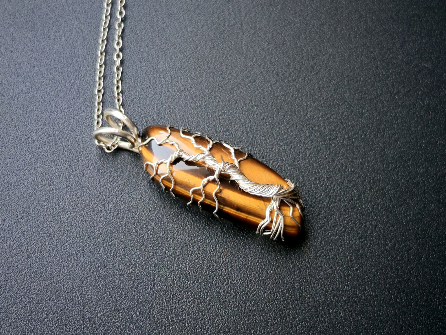 Tree pendant with a tiger's eye gemstone