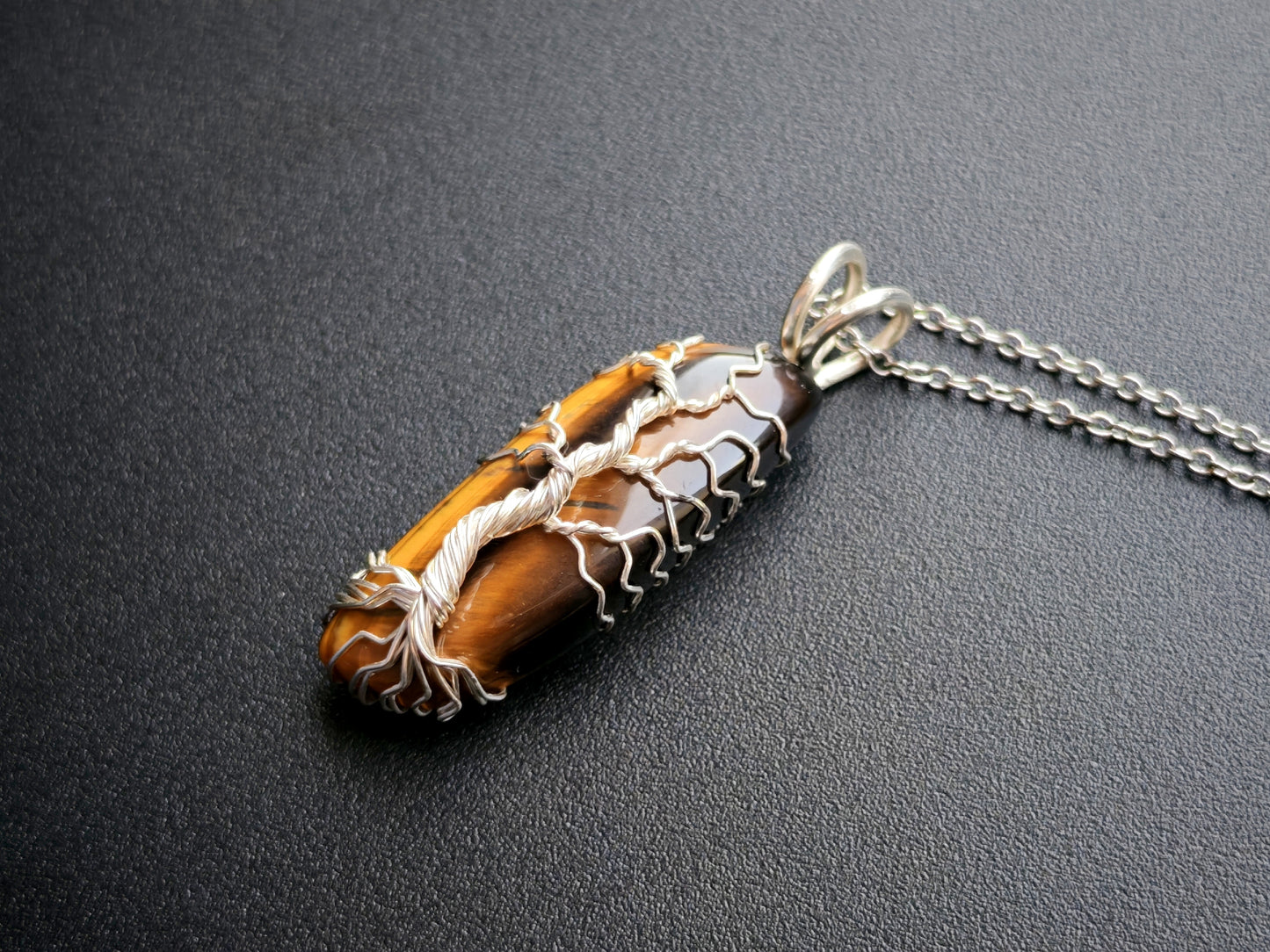 Tree pendant with a tiger's eye gemstone