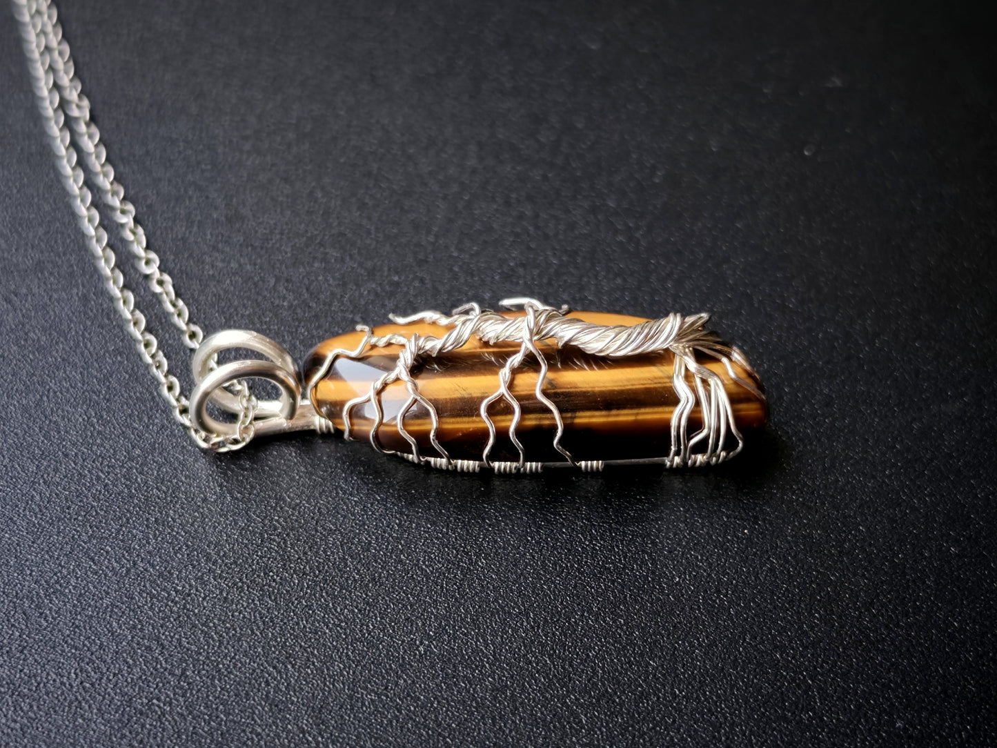 Tree pendant with a tiger's eye gemstone