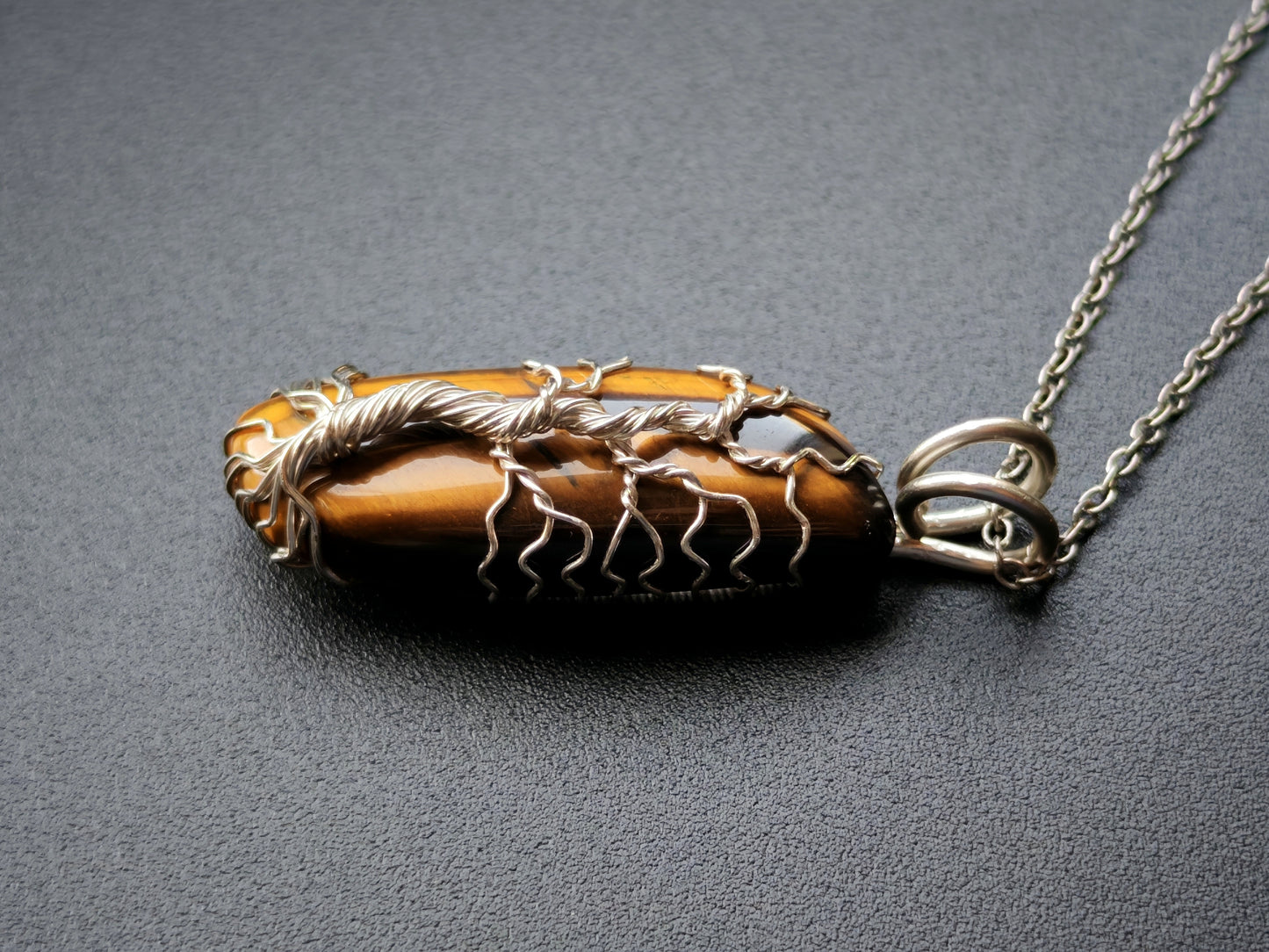 Tree pendant with a tiger's eye gemstone