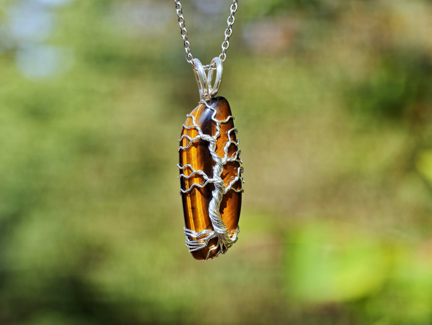 Tree pendant with a tiger's eye gemstone