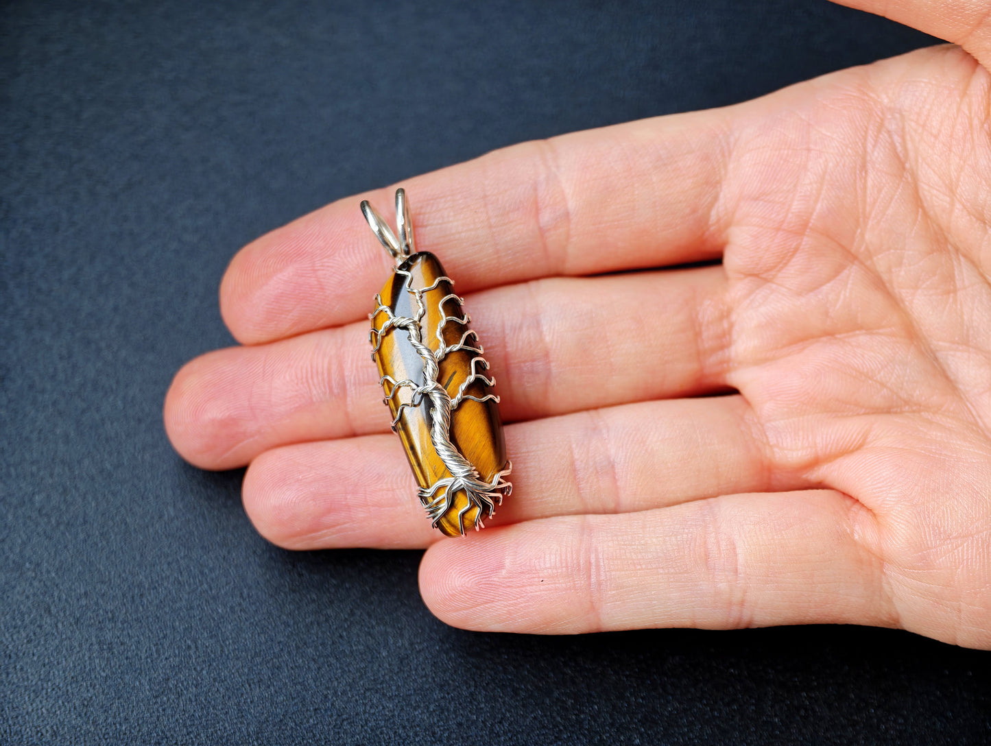 Tree pendant with a tiger's eye gemstone