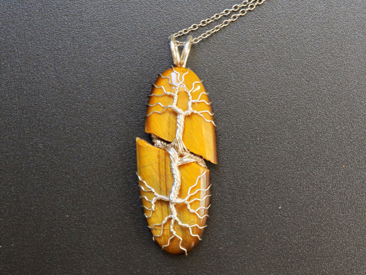 Tree pendant with a broken tiger's eye gemstone