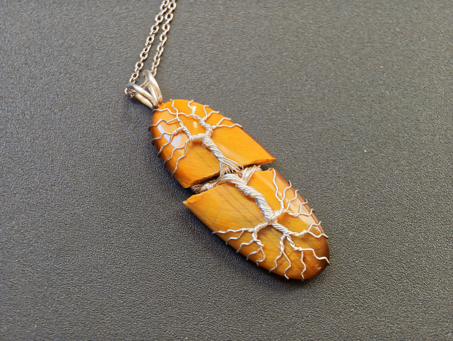Tree pendant with a broken tiger's eye gemstone
