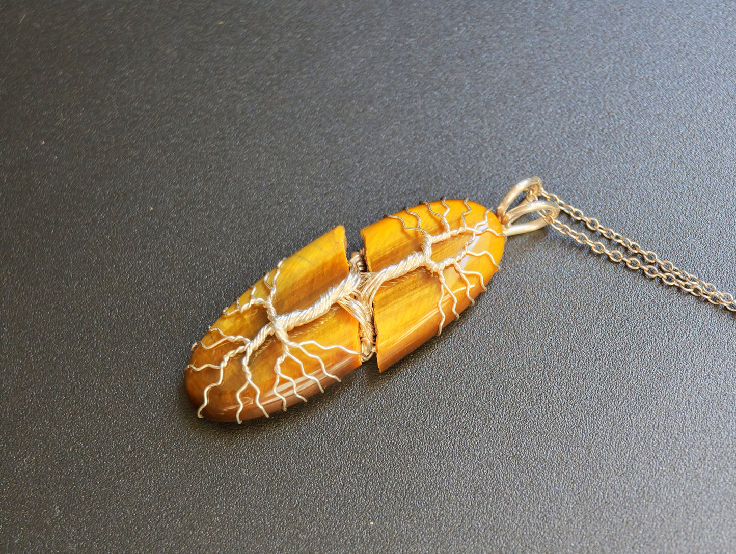 Tree pendant with a broken tiger's eye gemstone