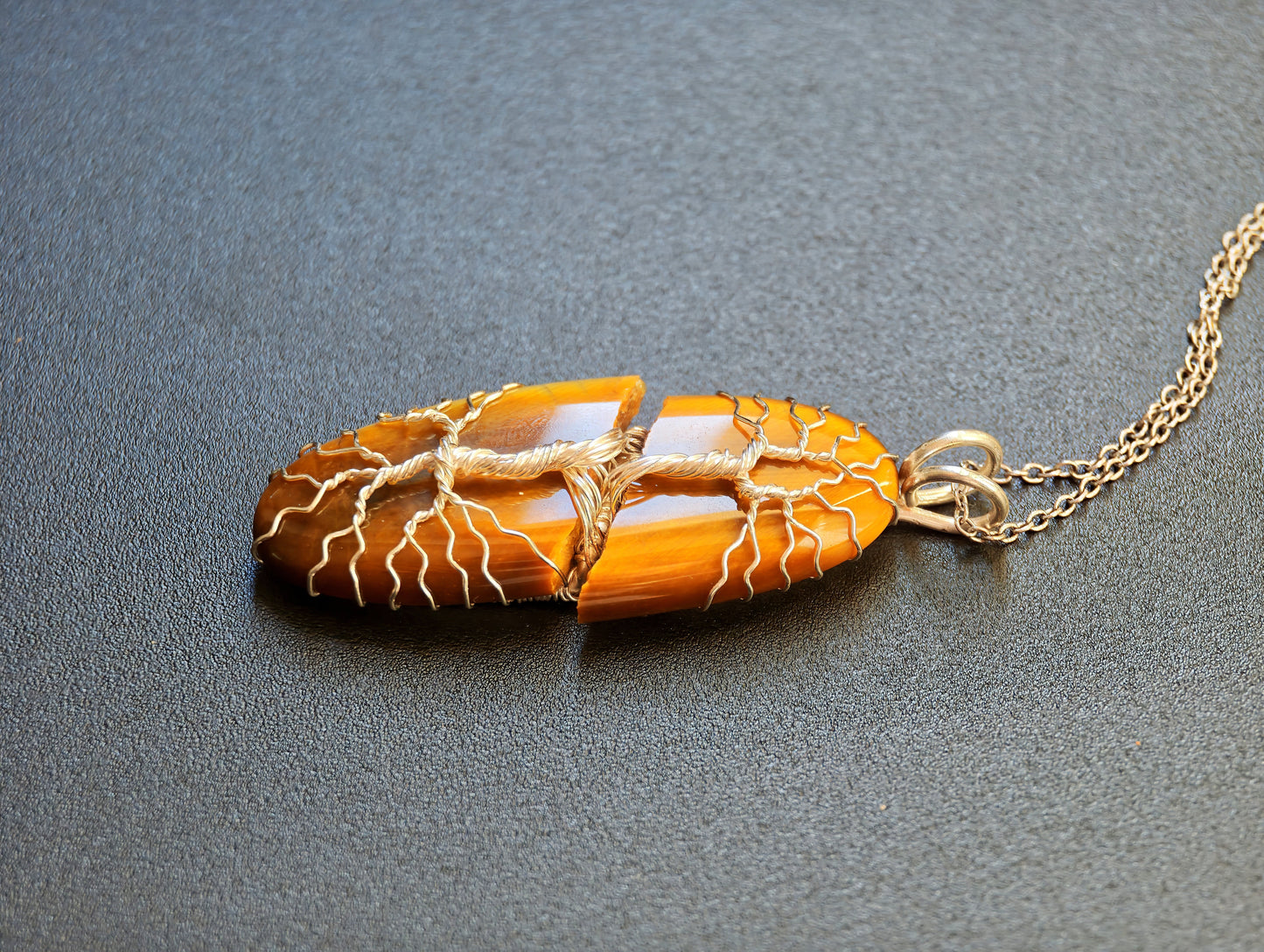 Tree pendant with a broken tiger's eye gemstone