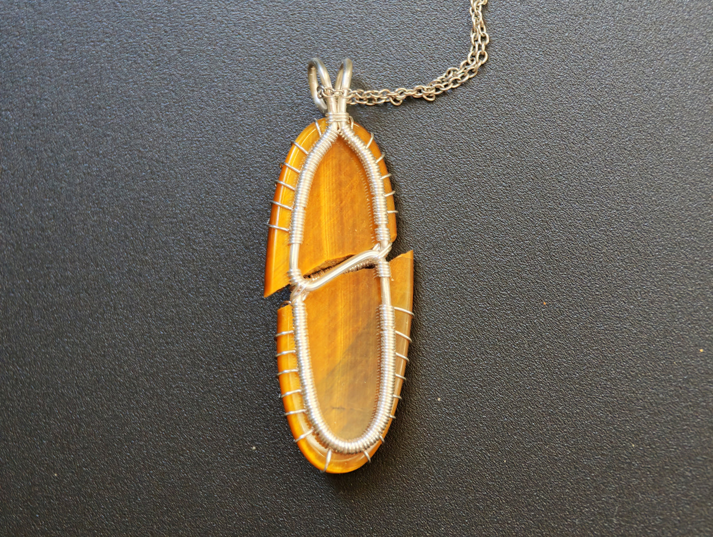 Tree pendant with a broken tiger's eye gemstone