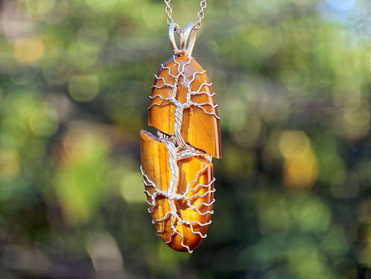 Tree pendant with a broken tiger's eye gemstone