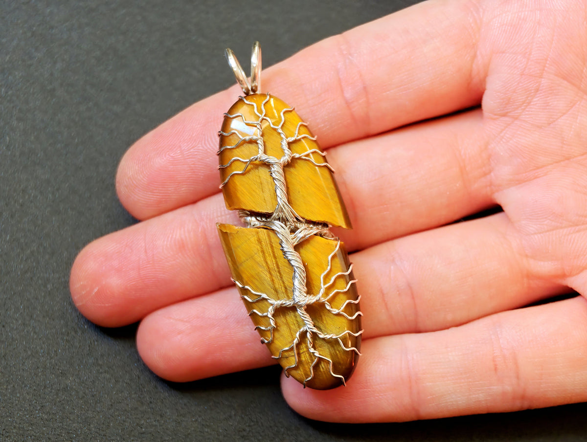 Tree pendant with a broken tiger's eye gemstone