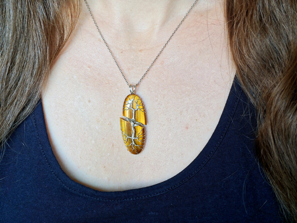 Tree pendant with a broken tiger's eye gemstone