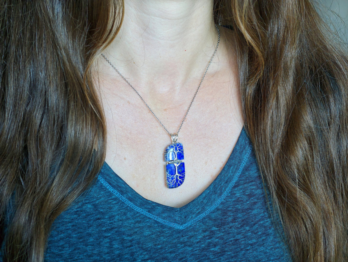 Tree pendant with a broken lapis lazuli gemstone
