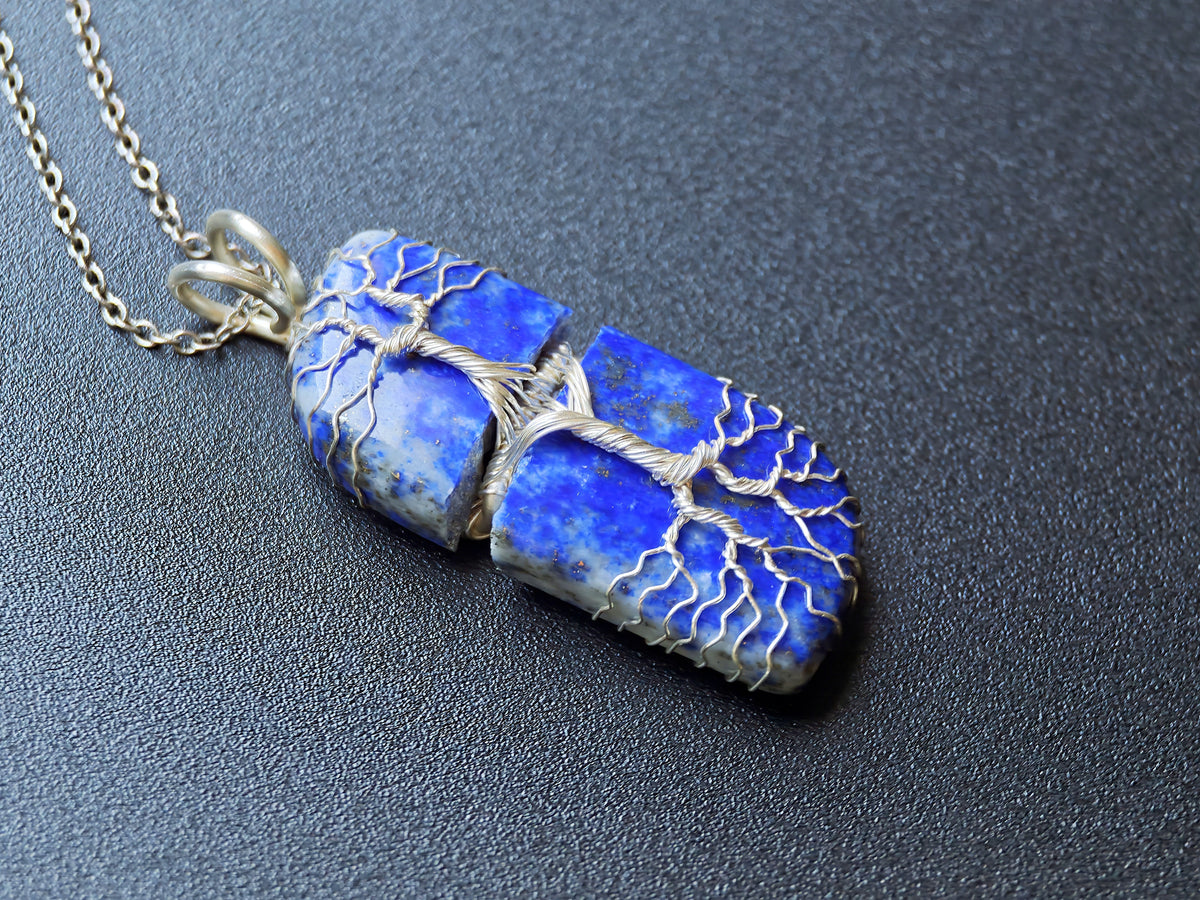 Tree pendant with a broken lapis lazuli gemstone