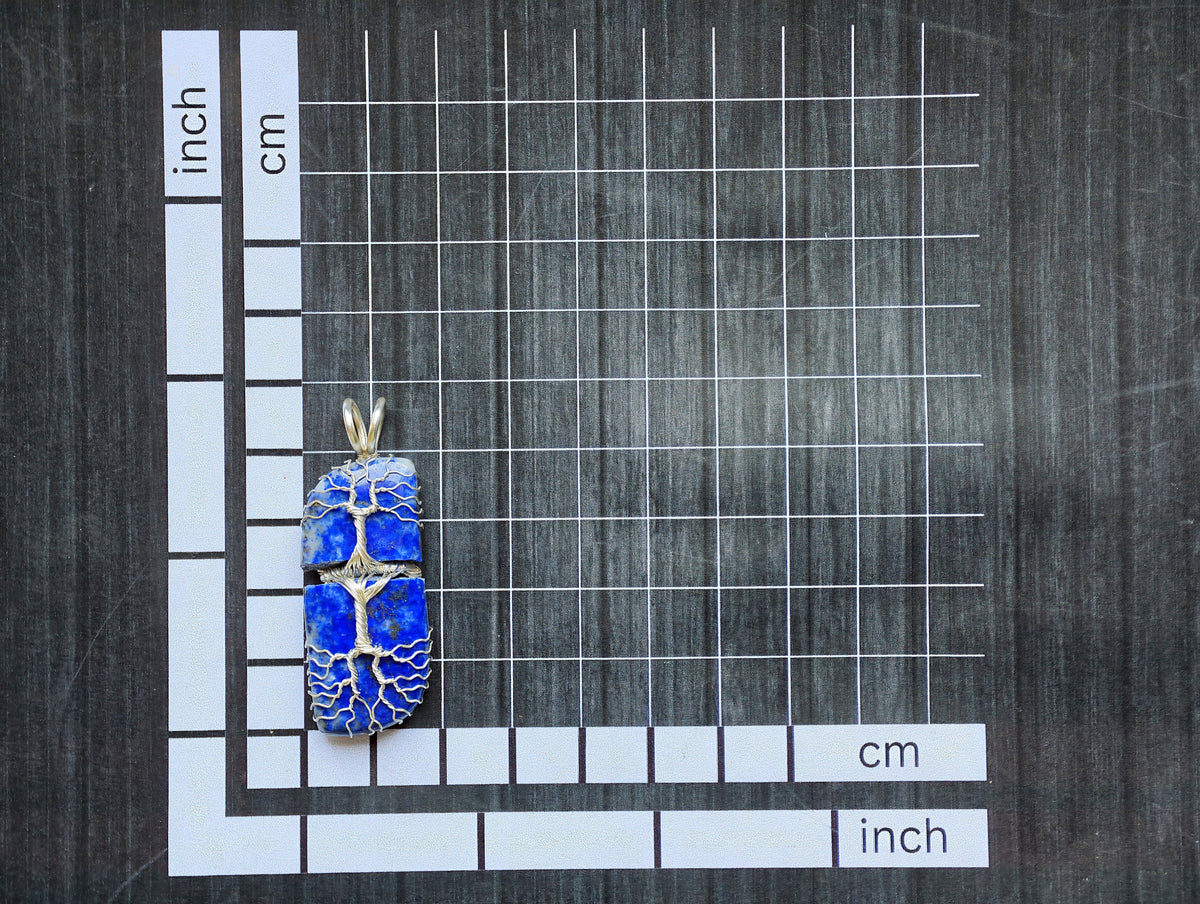 Tree pendant with a broken lapis lazuli gemstone