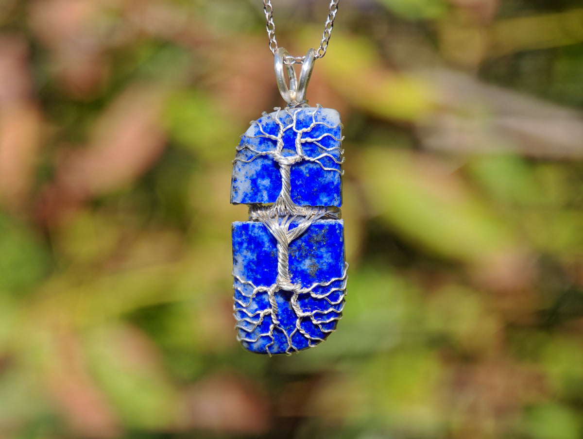 Tree pendant with a broken lapis lazuli gemstone