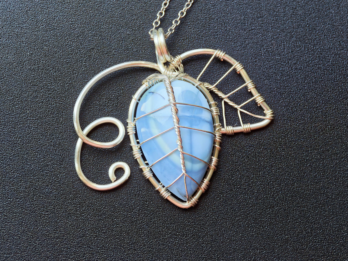 Leaf pendant with a blue opal gemstone