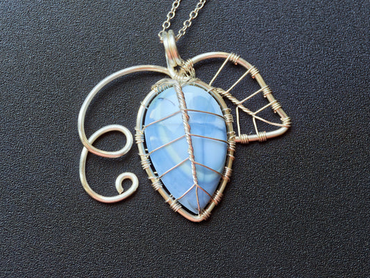 Leaf pendant with a blue opal gemstone