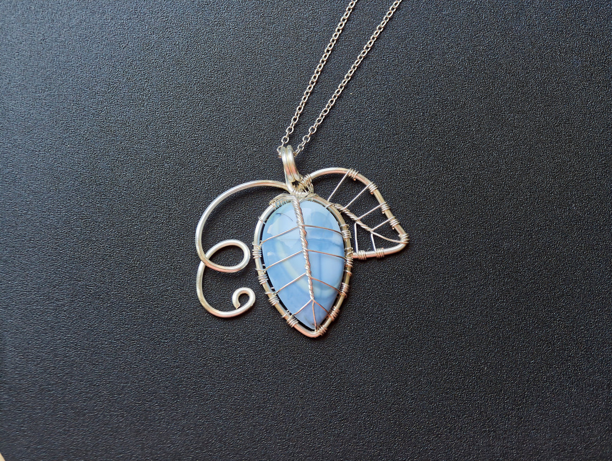 Leaf pendant with a blue opal gemstone