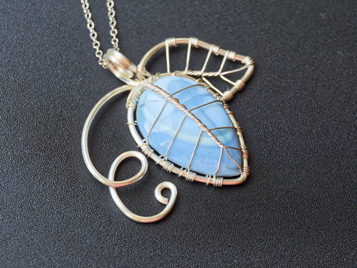 Leaf pendant with a blue opal gemstone