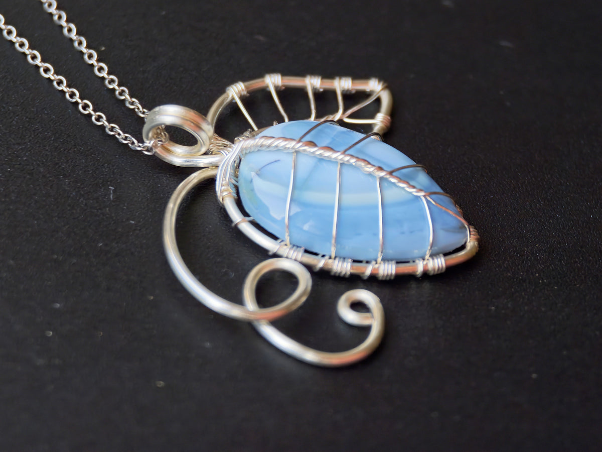Leaf pendant with a blue opal gemstone