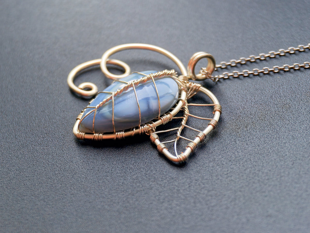 Leaf pendant with a blue opal gemstone