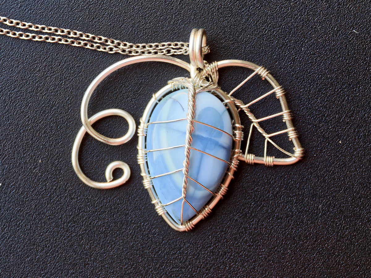 Leaf pendant with a blue opal gemstone