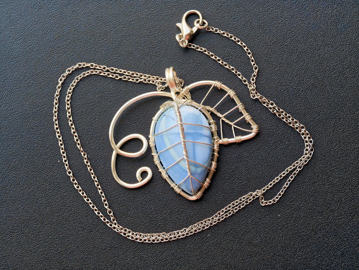 Leaf pendant with a blue opal gemstone